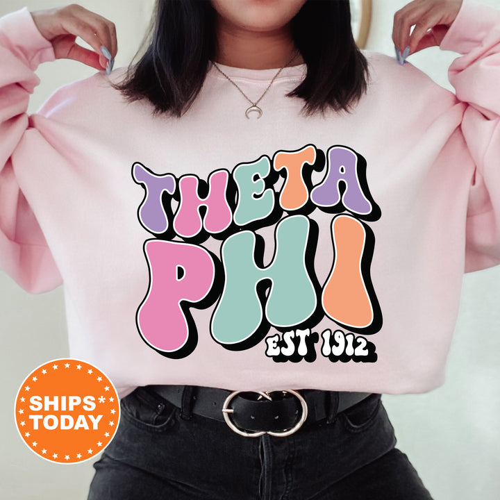 a woman wearing a pink sweatshirt with the words treat pud est 123 on it