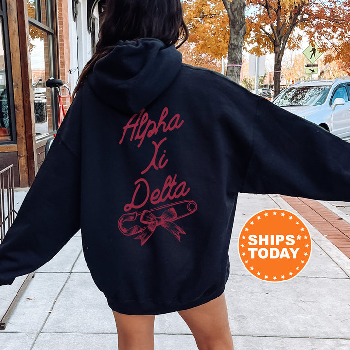 a woman in a black hoodie is walking down the street