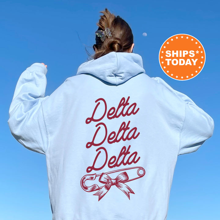 a woman with her back to the camera wearing a white hoodie that says delta