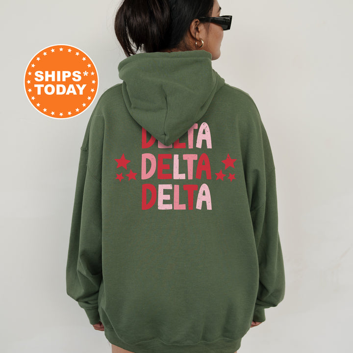 a woman wearing a green hoodie that says la delta delta