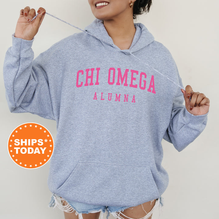 a woman wearing a blue hoodie that says chi omega