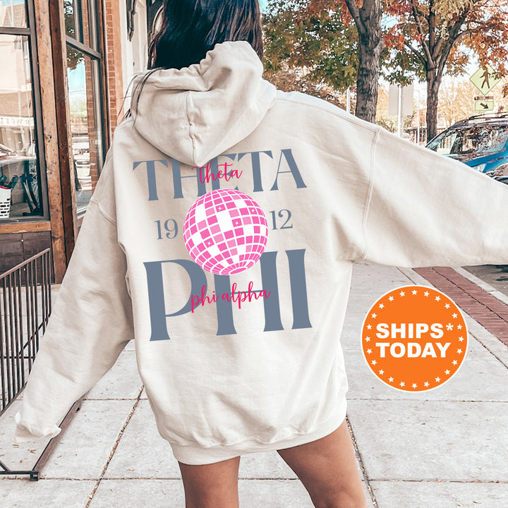 a woman in a white hoodie is walking down the street