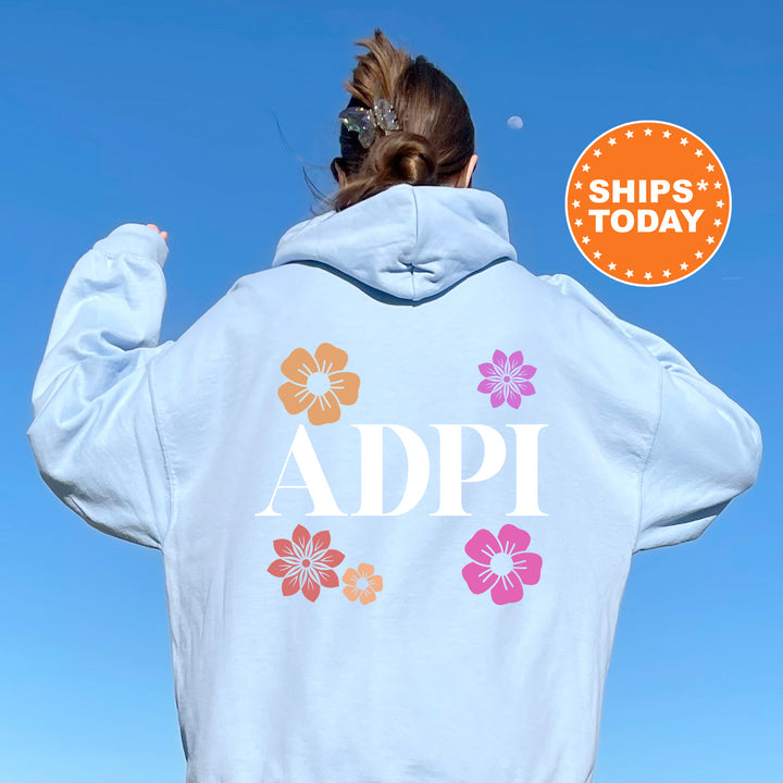 a woman with her back to the camera wearing a white hoodie