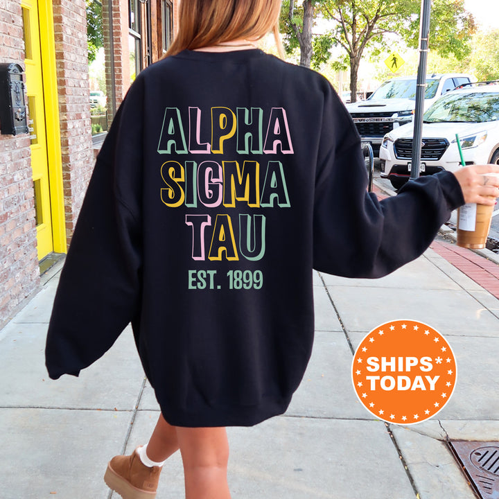 a woman walking down a sidewalk wearing a black sweatshirt