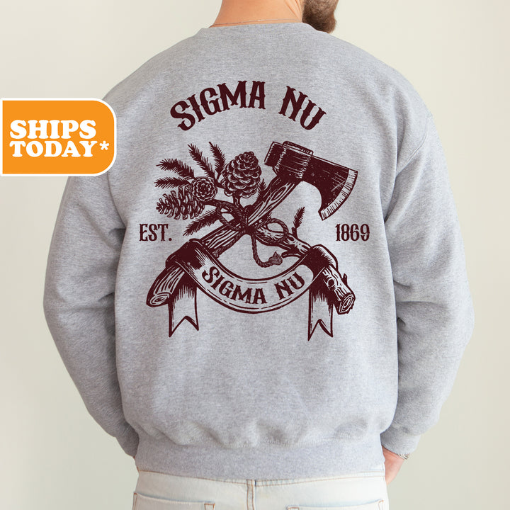 a man wearing a sweatshirt with a hammer and pine tree on it