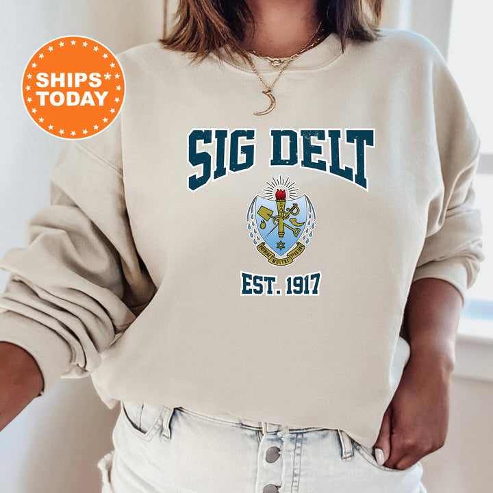 a woman wearing a sweatshirt that says sig delt est 1917