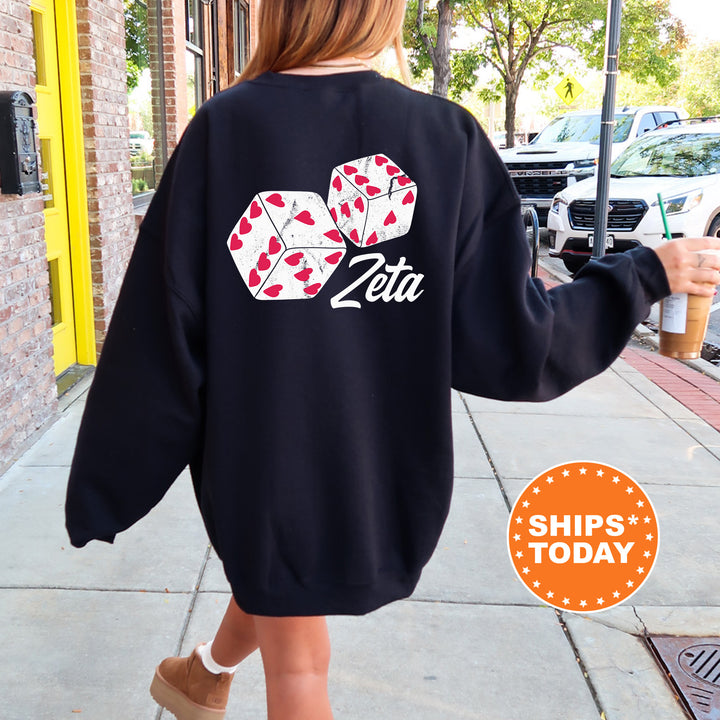 a woman walking down a sidewalk wearing a black sweatshirt