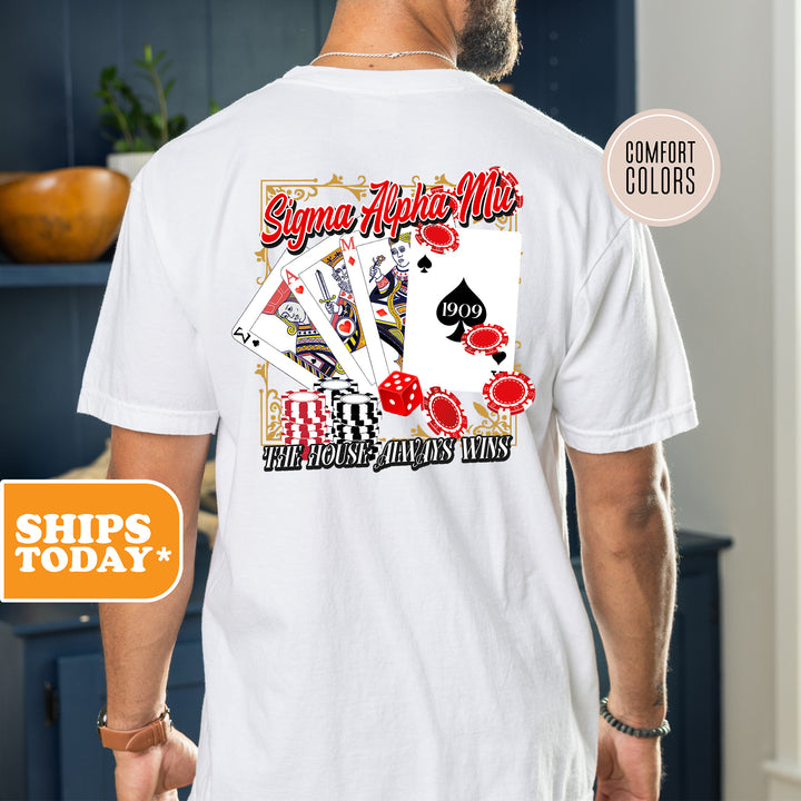 a man wearing a t - shirt with playing cards on it