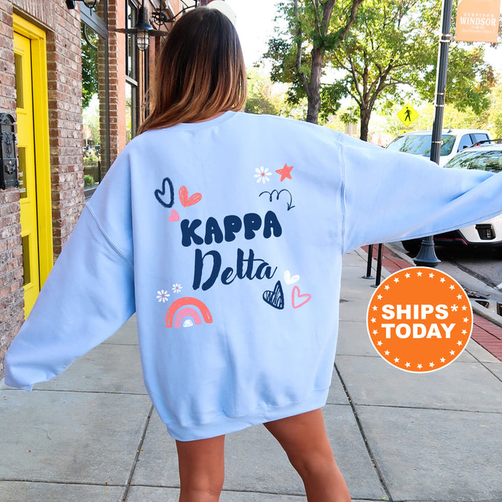 a woman walking down a sidewalk wearing a blue sweatshirt