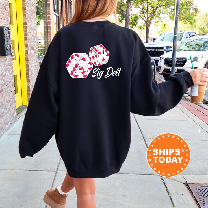 a woman walking down a sidewalk wearing a black sweatshirt
