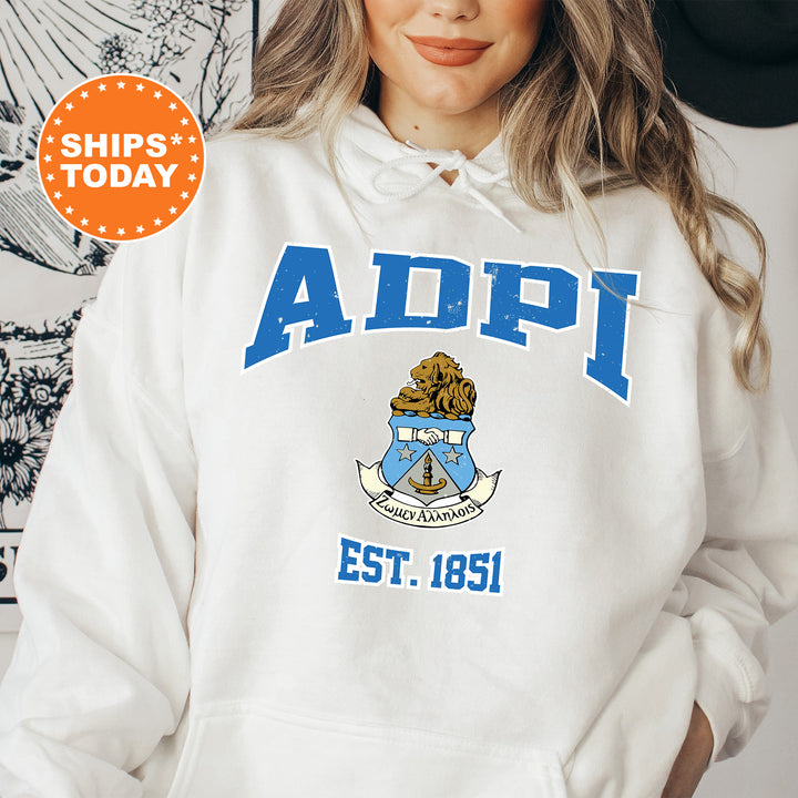 a woman wearing a white hoodie with an adpi logo on it