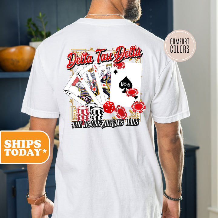 a man wearing a white shirt with a picture of playing cards on it