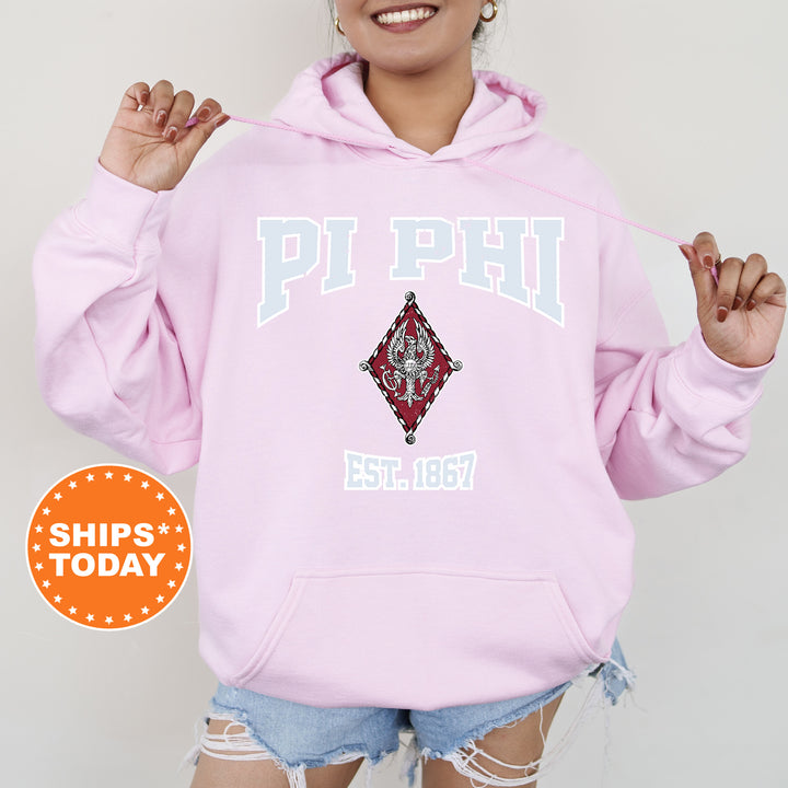 a woman wearing a pink hoodie and ripped shorts