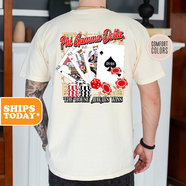 a man wearing a white shirt with a picture of playing cards on it