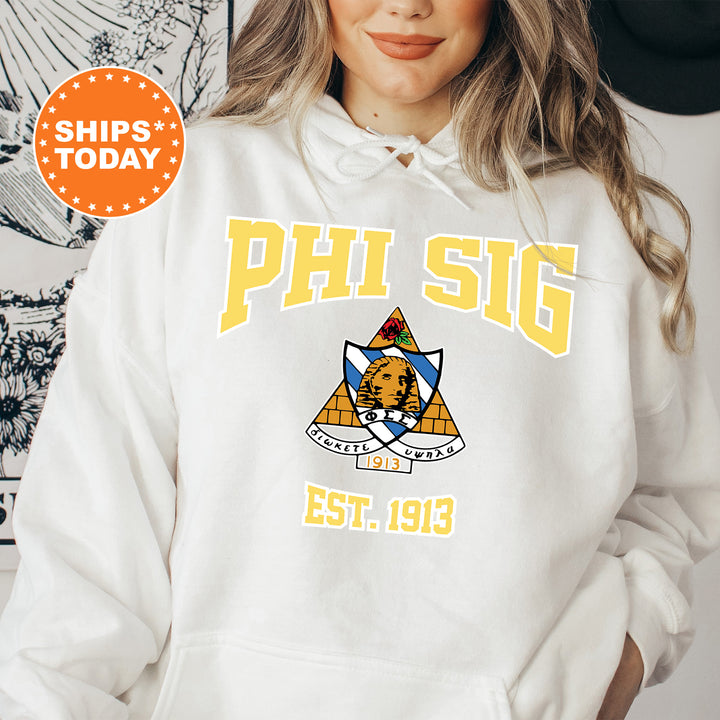 a woman wearing a white phi sig hoodie
