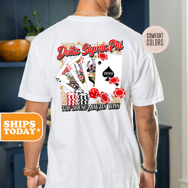 a man wearing a white shirt with a picture of a deck of cards on it