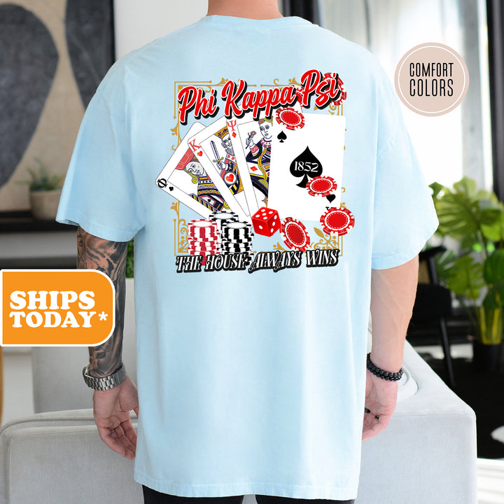 a man wearing a blue shirt with a picture of playing cards on it