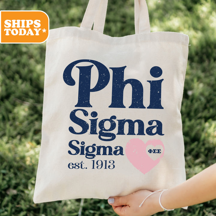a person holding a bag that says phi sigma