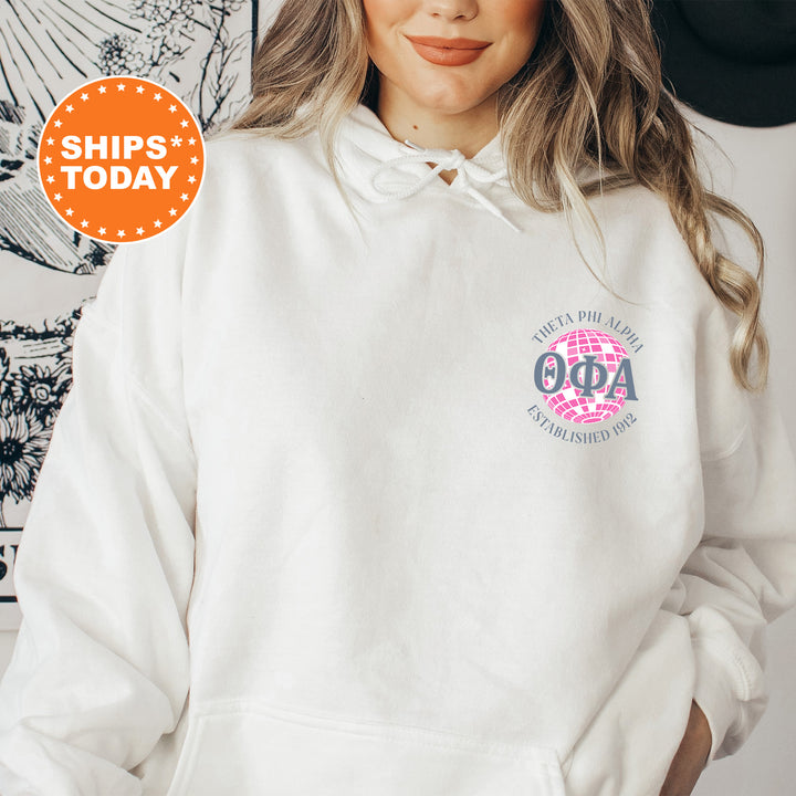 a woman wearing a white hoodie and a black hat