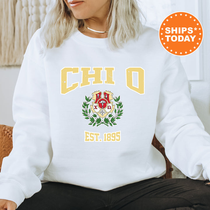 a woman sitting on a chair wearing a white sweatshirt