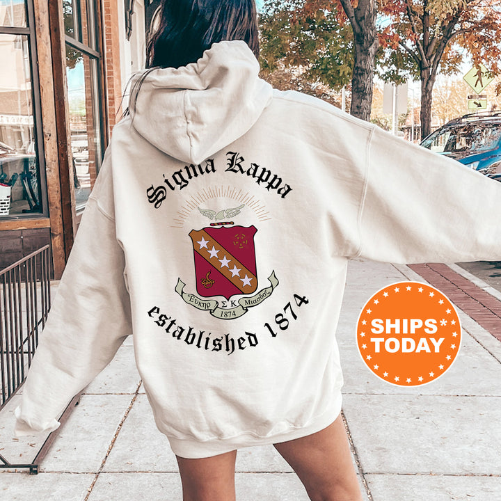 a woman walking down a sidewalk wearing a white hoodie