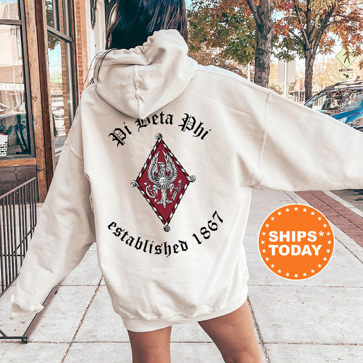 a woman walking down a sidewalk wearing a white hoodie