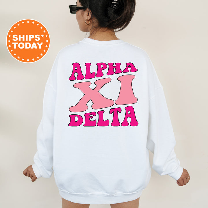 a woman wearing a white sweatshirt with pink letters on it