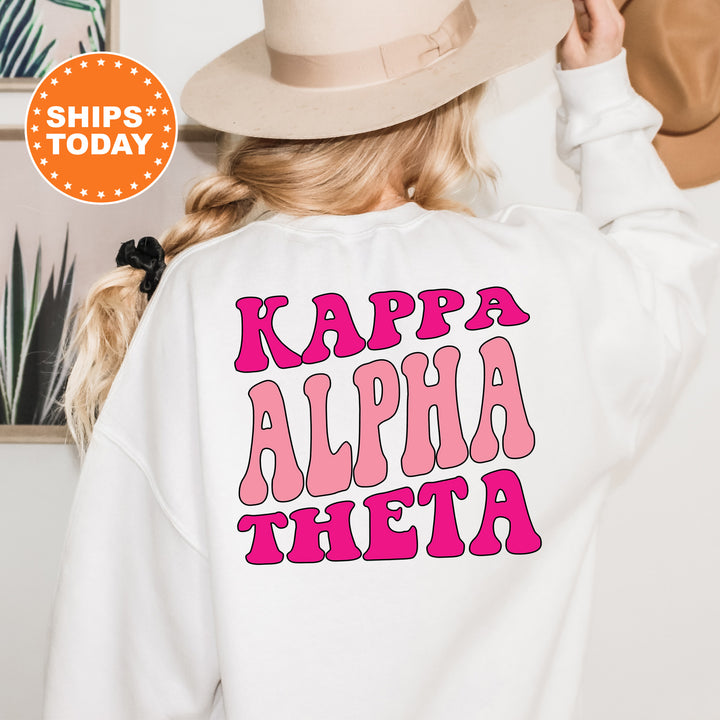 a woman wearing a white sweatshirt with pink letters on it