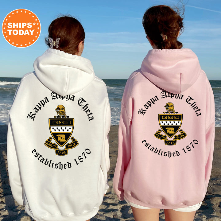 two women wearing pink and white hoodies on the beach