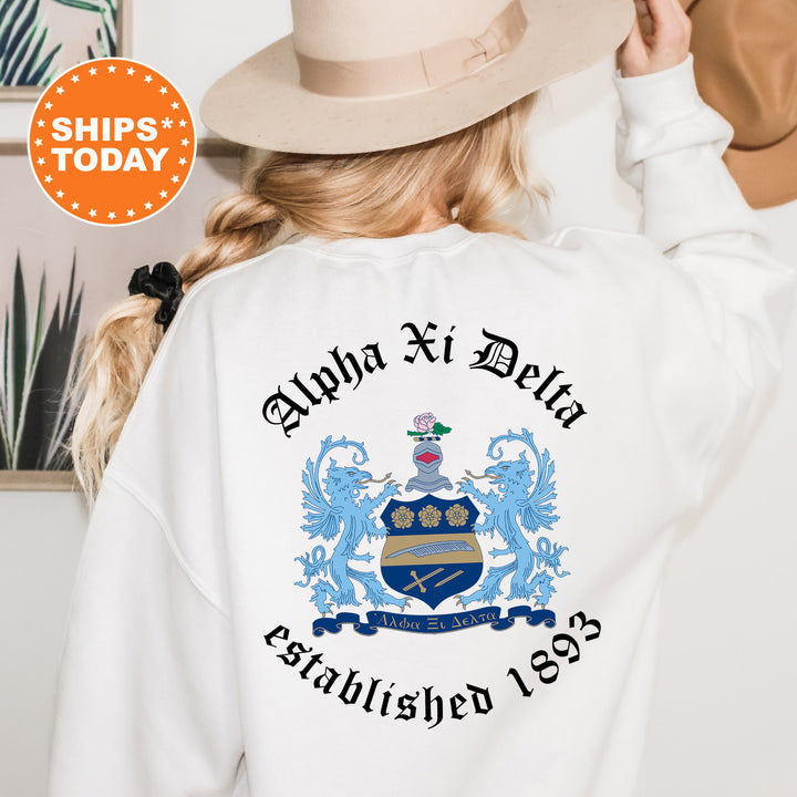 a woman wearing a white sweatshirt with a coat of arms on it