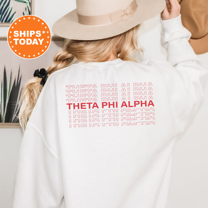 a woman wearing a white sweatshirt with a hat on her head