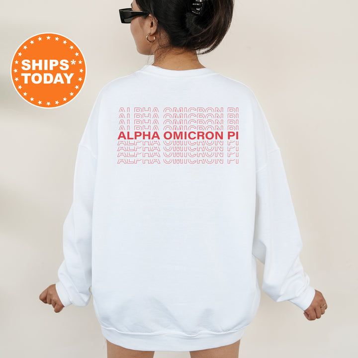 a woman wearing a white sweatshirt with a red graphic on it