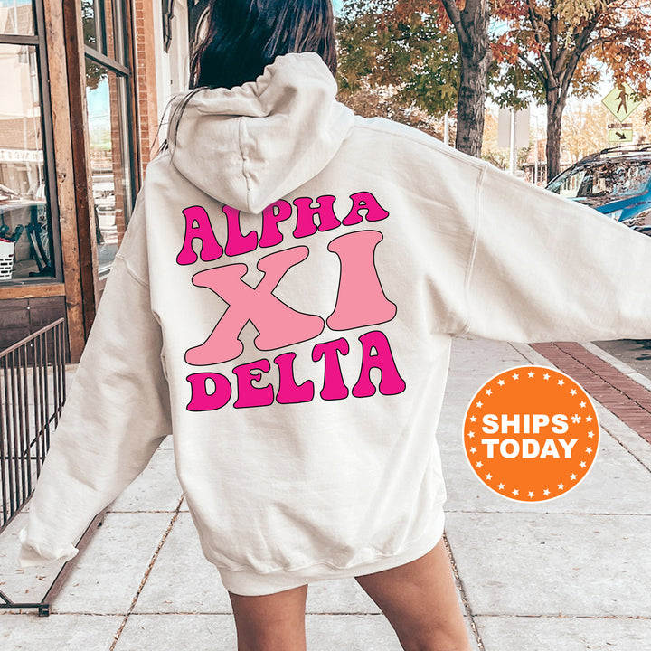 a woman walking down a sidewalk wearing a white hoodie
