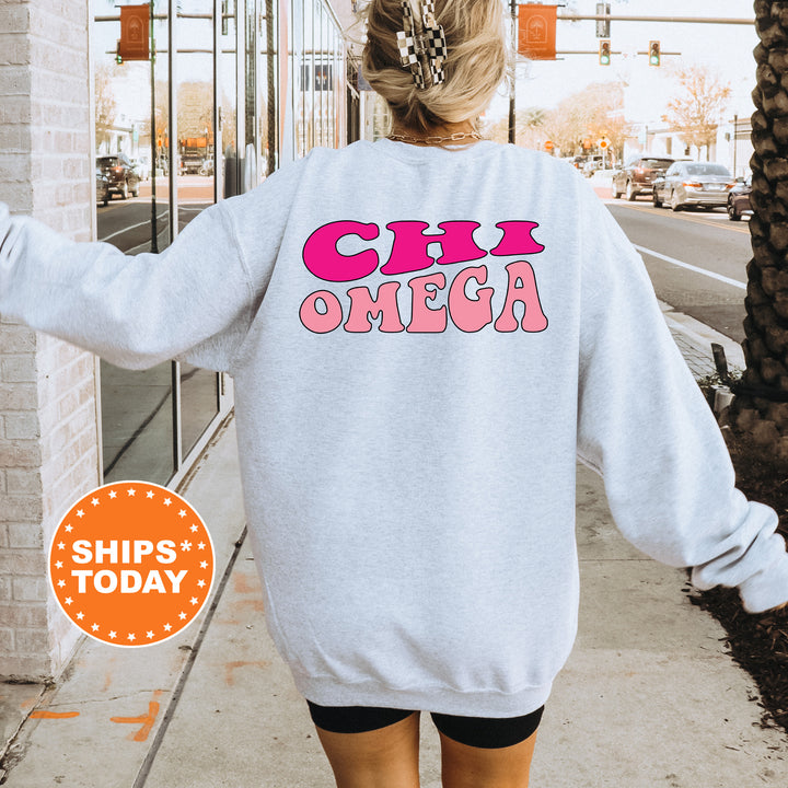 a woman walking down a sidewalk wearing a sweatshirt