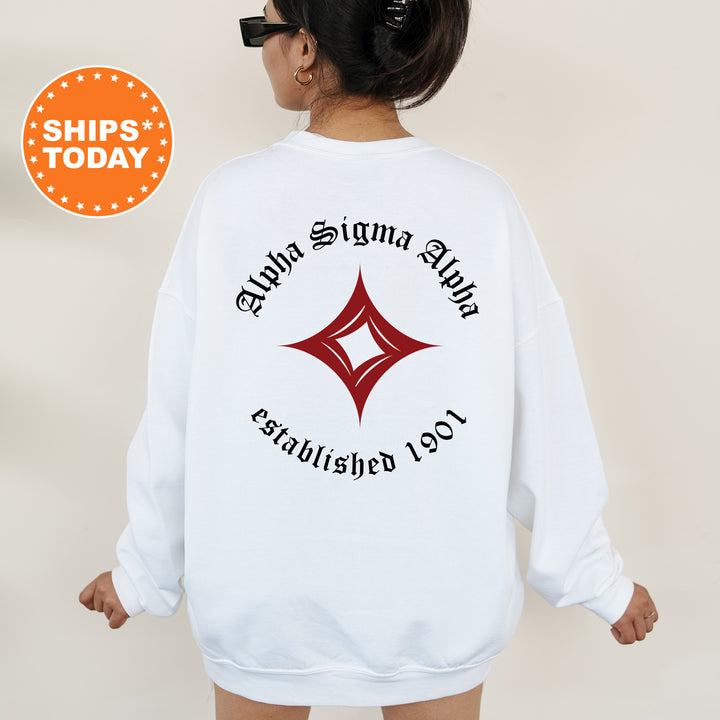 a woman wearing a white sweatshirt with a black and red logo