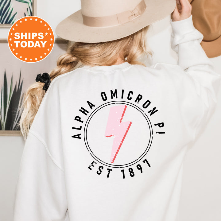 a woman wearing a white sweatshirt with a lightning bolt on it