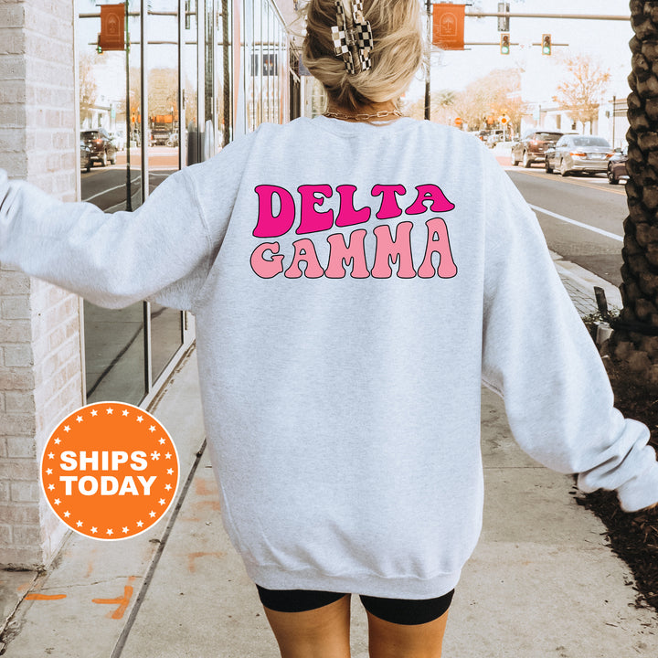 a woman walking down a sidewalk wearing a sweatshirt