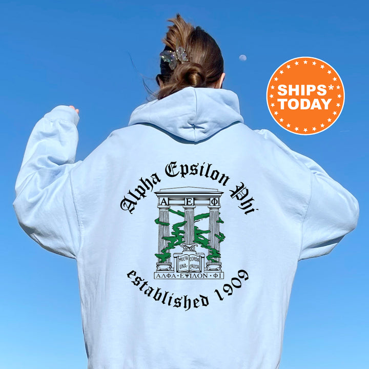 a woman wearing a white hoodie with a green and white design on it