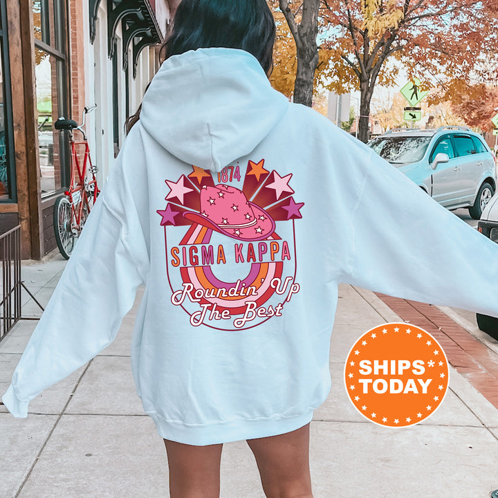 a woman in a white hoodie is walking down the street