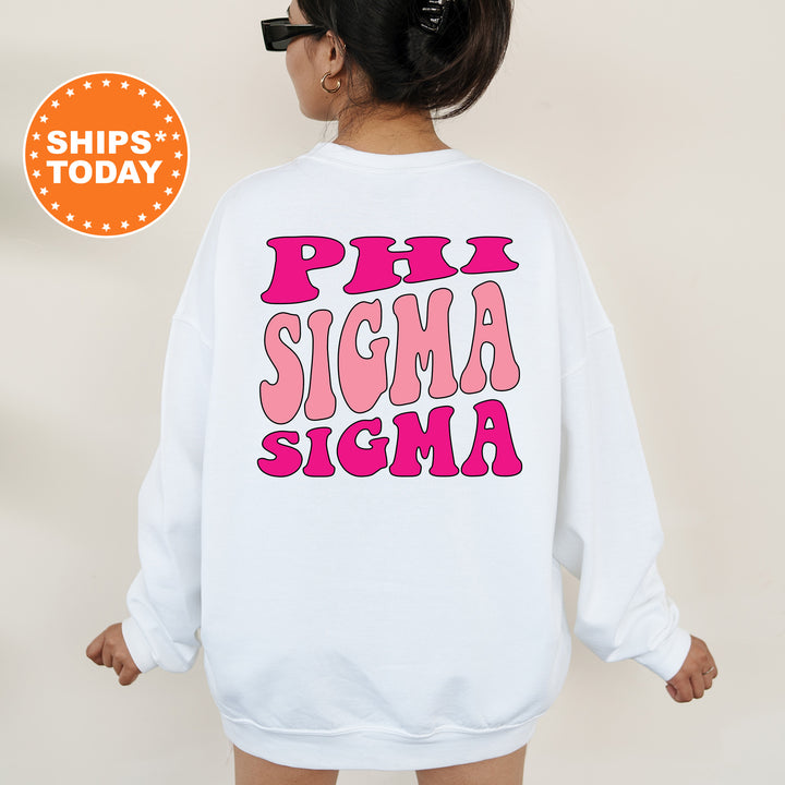 a woman wearing a white sweatshirt with pink letters on it