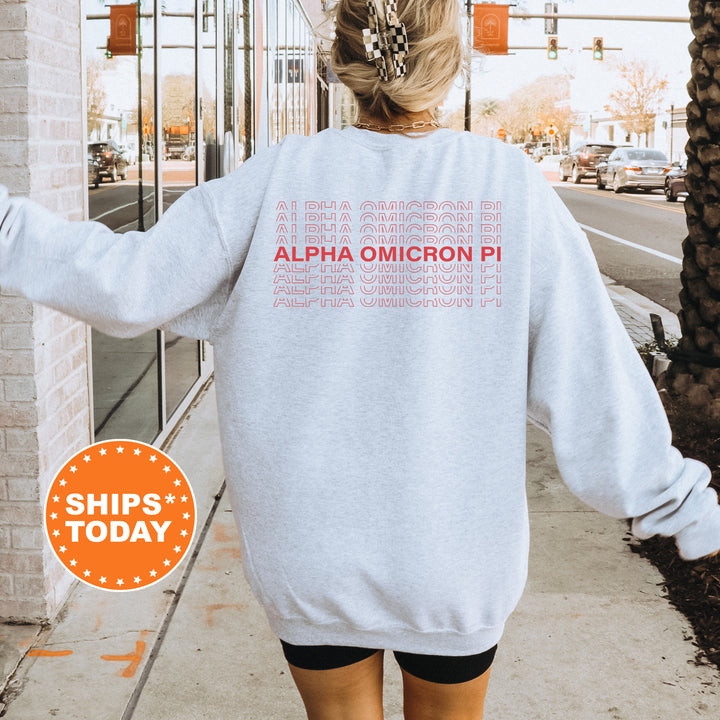 a woman walking down a sidewalk wearing a sweatshirt