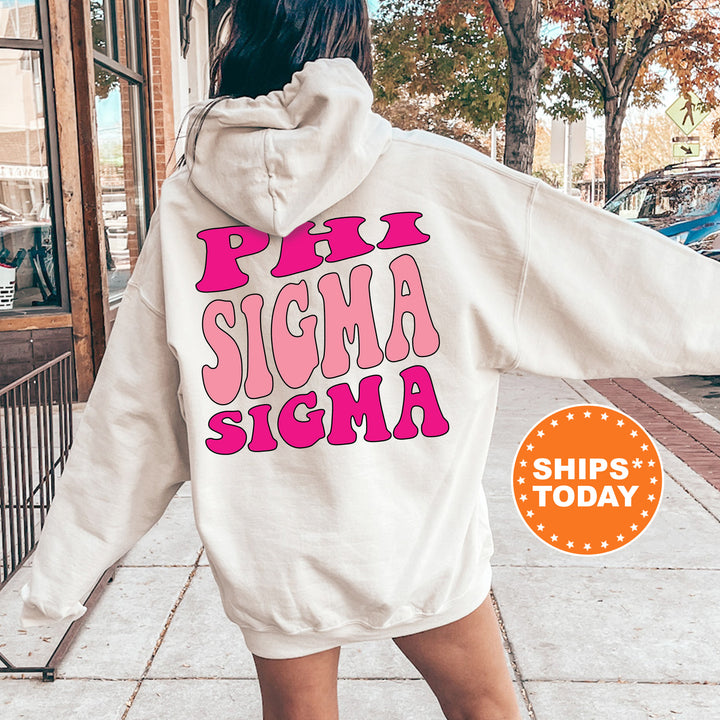 a woman walking down a sidewalk wearing a white hoodie