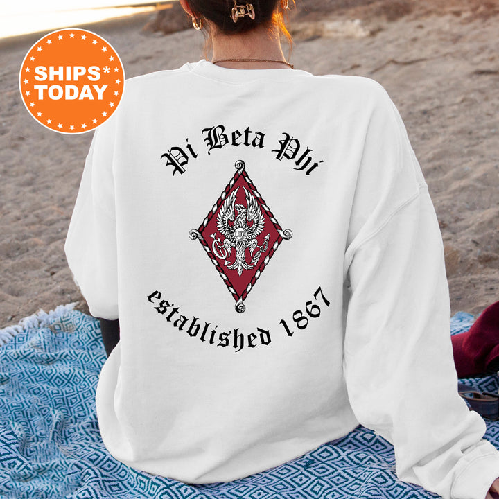 a woman sitting on a blanket on the beach