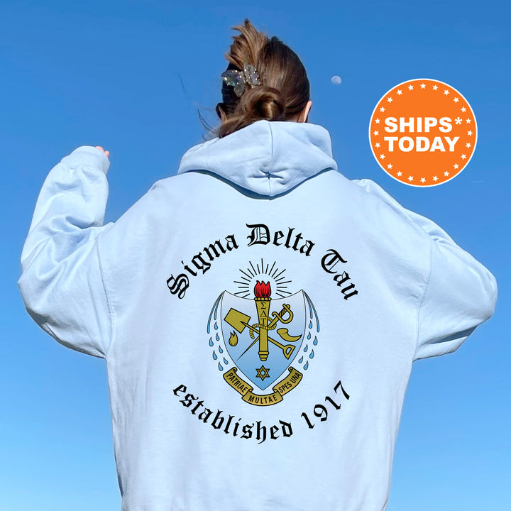 a woman wearing a white hoodie with a blue sky in the background