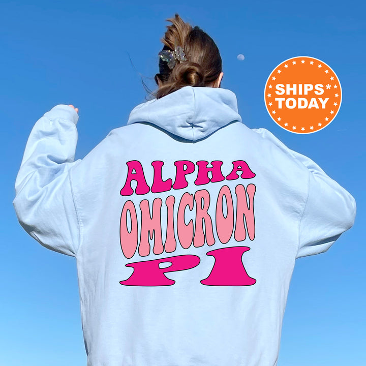 a woman wearing a white hoodie with pink letters on it