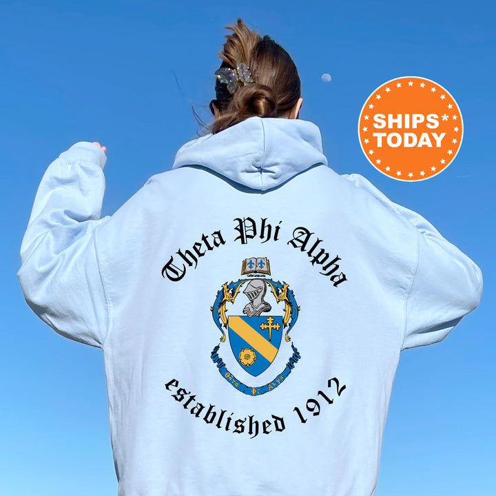 a woman wearing a white hoodie with a blue sky in the background