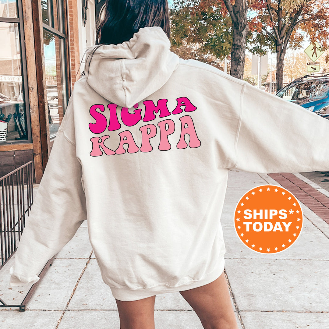 a woman in a white hoodie that says suma kappa