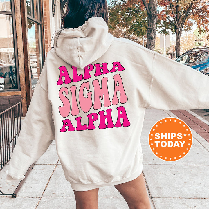 a woman walking down a sidewalk wearing a white hoodie