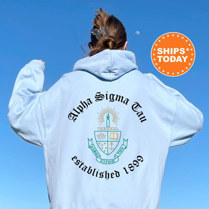 a woman wearing a white hoodie with a blue sky in the background