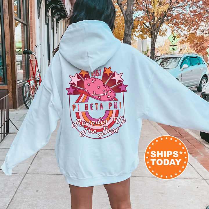 a woman in a white hoodie is walking down the street